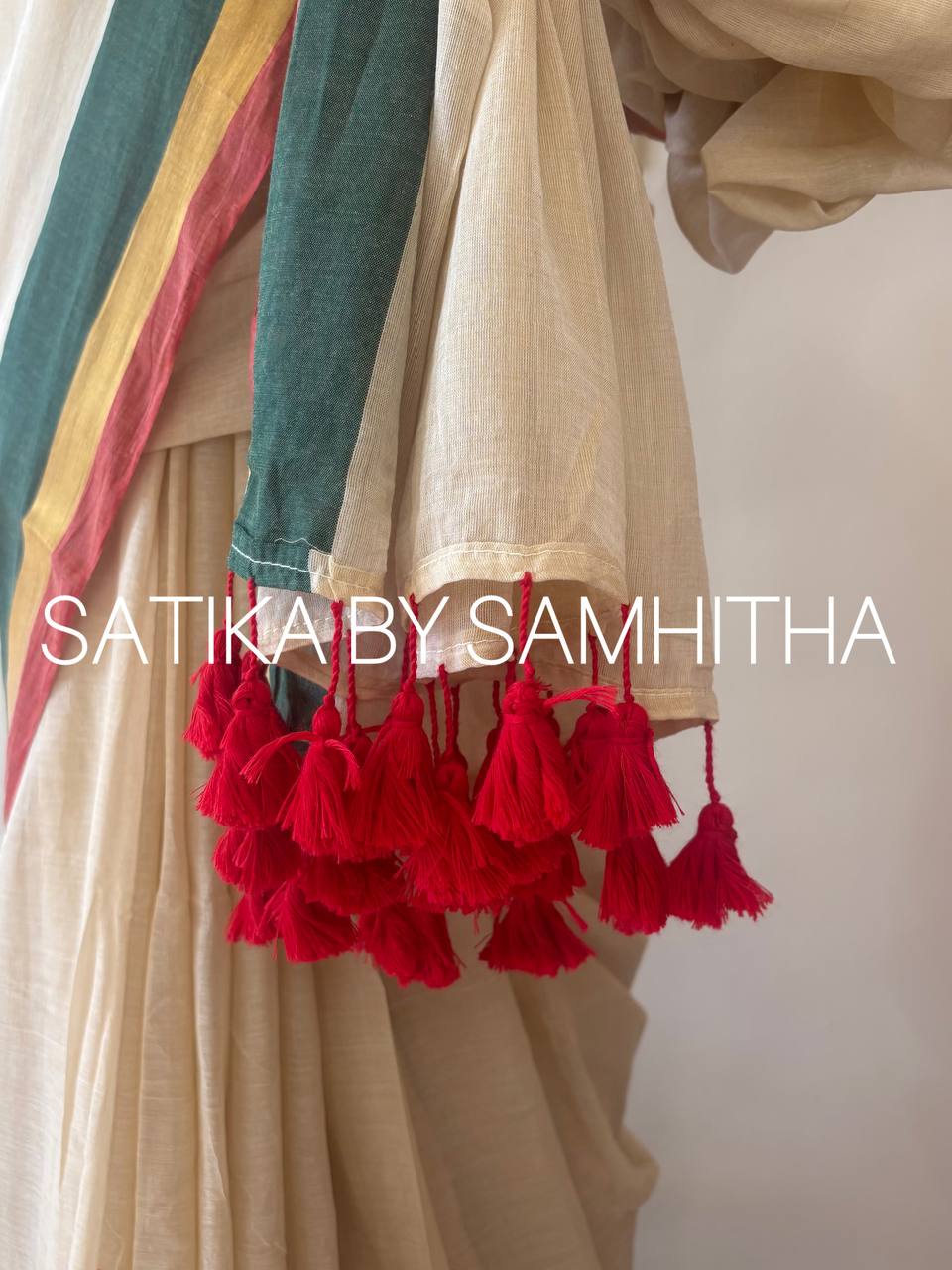STSC10 - 120 count premium Mulcotton saree, A sophisticated cream-beige base paired with a bold, tri-color border in deep forest green, gold zari, and crimson red, Pre booking open now, dispatch within 10 working days