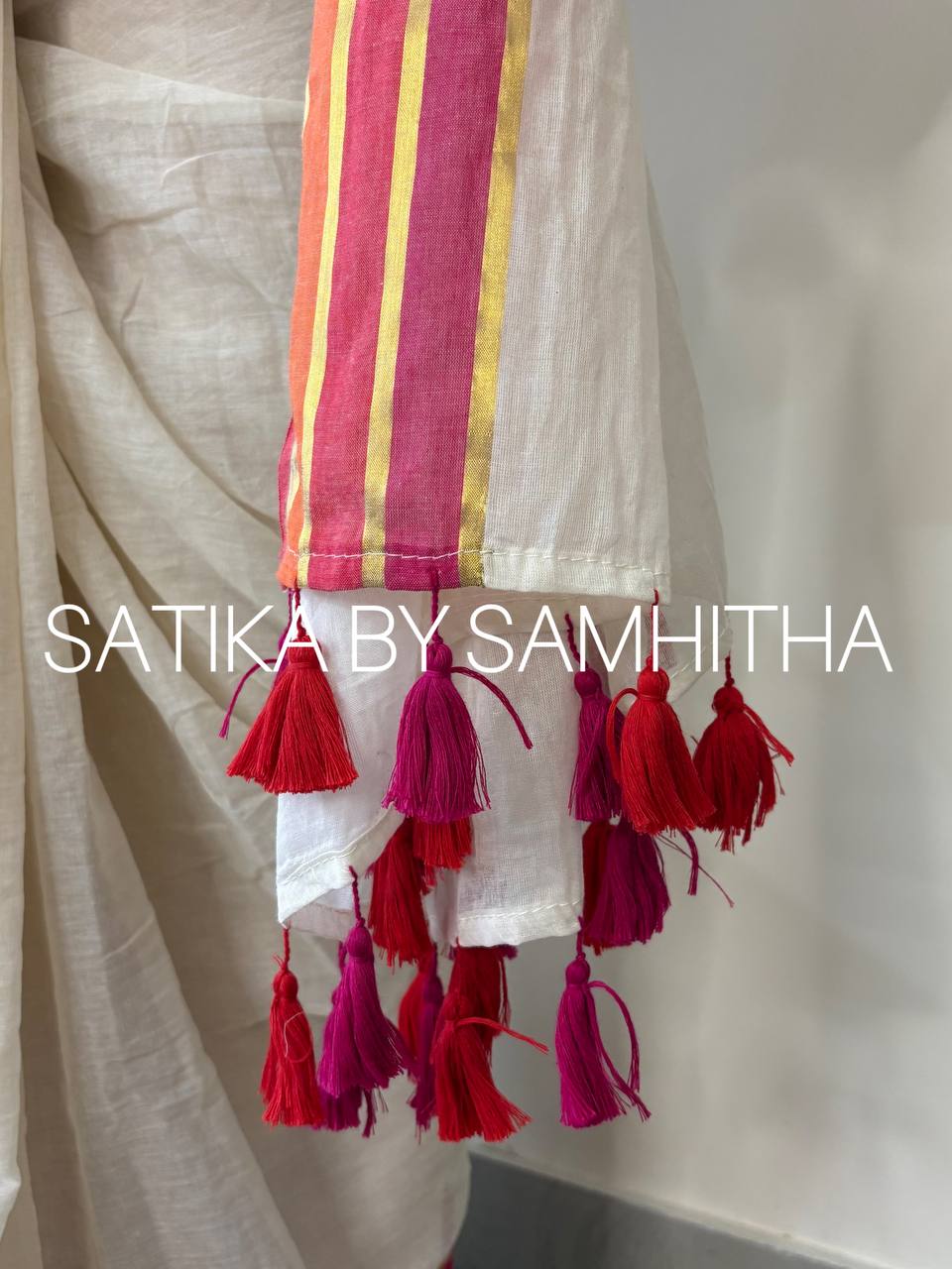 STSC29 - Pure 120 count Mulcotton Saree, Offwhite body with multi coloured (bright pink, red and coral) and golden zeri stripes border, Pre booking open now, dispatch within 10 working days