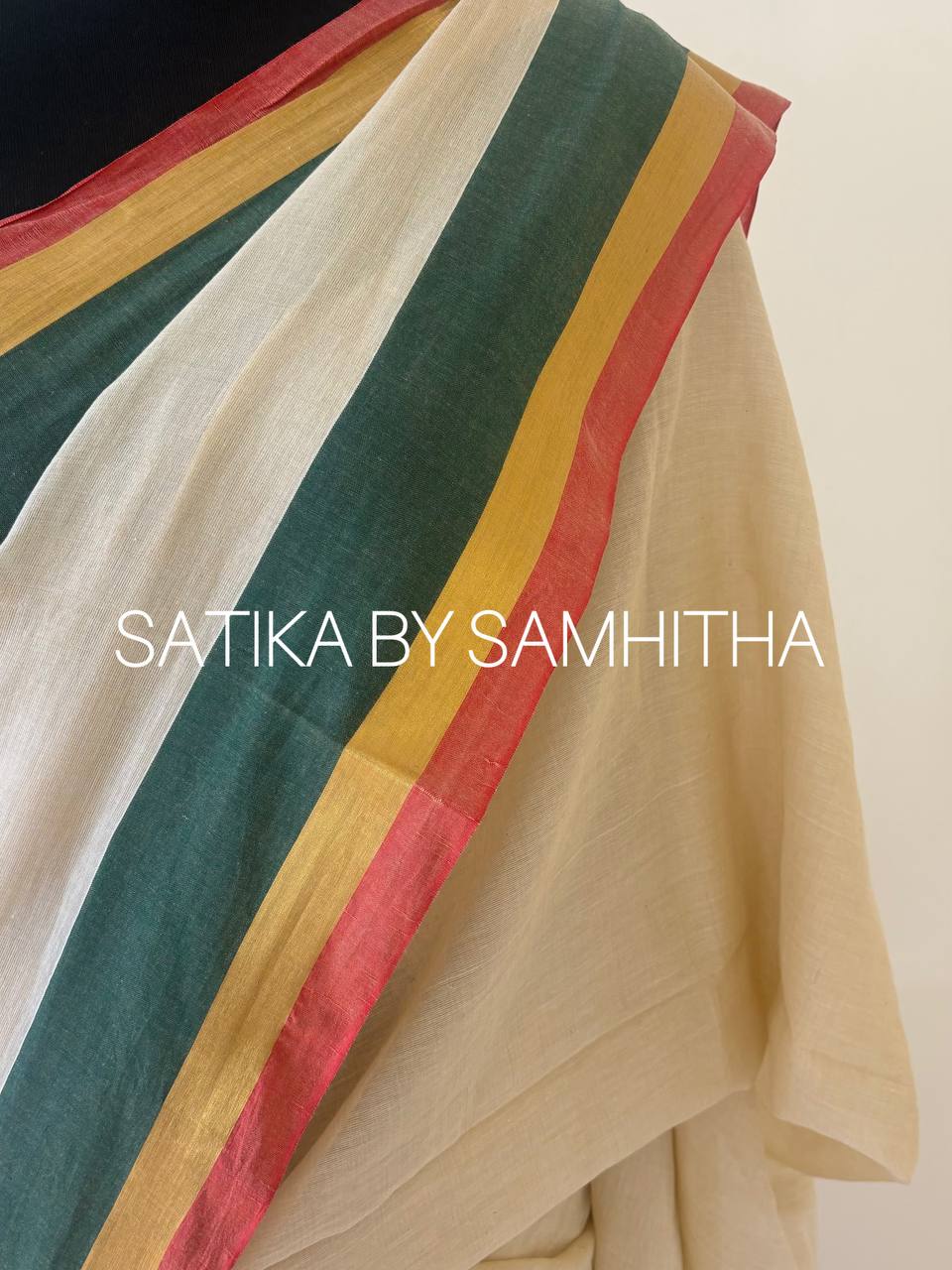 STSC10 - 120 count premium Mulcotton saree, A sophisticated cream-beige base paired with a bold, tri-color border in deep forest green, gold zari, and crimson red, Pre booking open now, dispatch within 10 working days