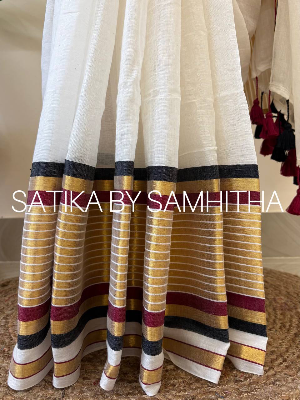 STSC23 - Pure 120 count Mulcotton Saree, Offwhite body with a rich gold zeri border highlighted with elegant black and maroon stripes. ,Pre booking open now, dispatch within 10 working days