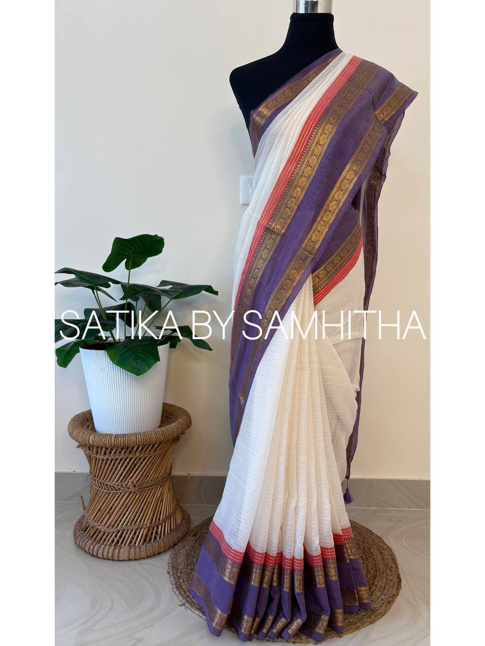 STSC35 - Pure 120 count Mulcotton Saree, subtly textured off-white body, striking lavender kanchi border, coral pink accent lines along with golden zeri stripes, Ready to dispatch