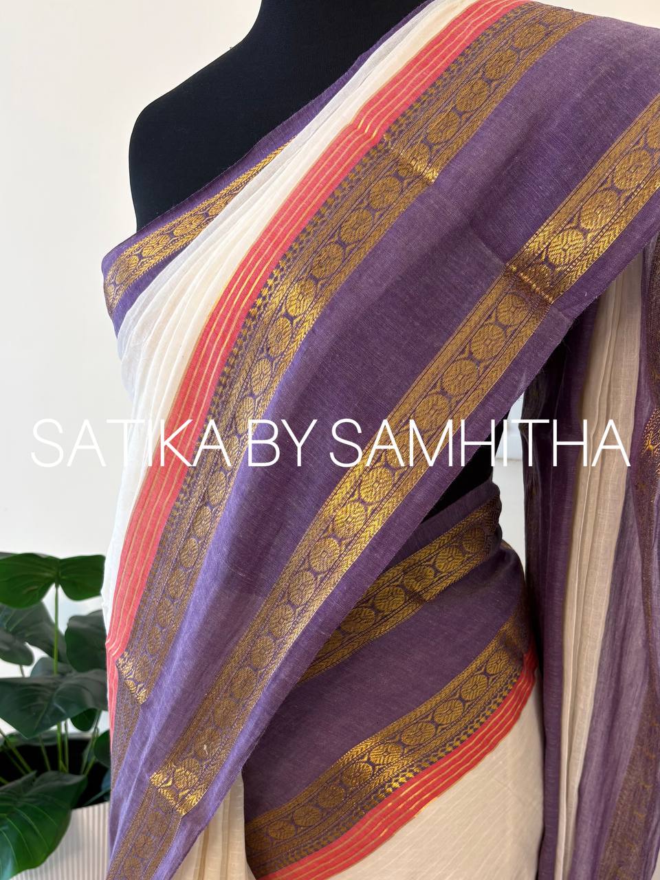 STSC35 - Pure 120 count Mulcotton Saree, subtly textured off-white body, striking lavender kanchi border, coral pink accent lines along with golden zeri stripes, Ready to dispatch