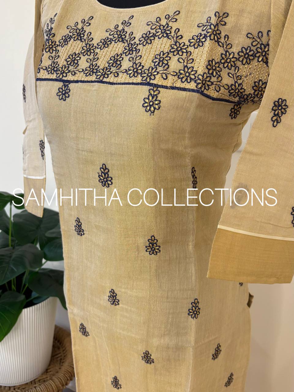 SC3290 - Kerala Tissue kurtis with allover floral embroidery highlighted with kasavu borders on daman line and sleeve ends