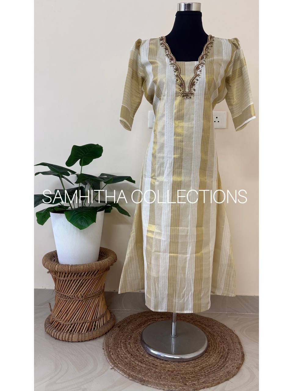 SC3295 - Kerala Tissue kurtis with allover kasavu stripes highlighted with intricately handworked neckline and small puff sleeves